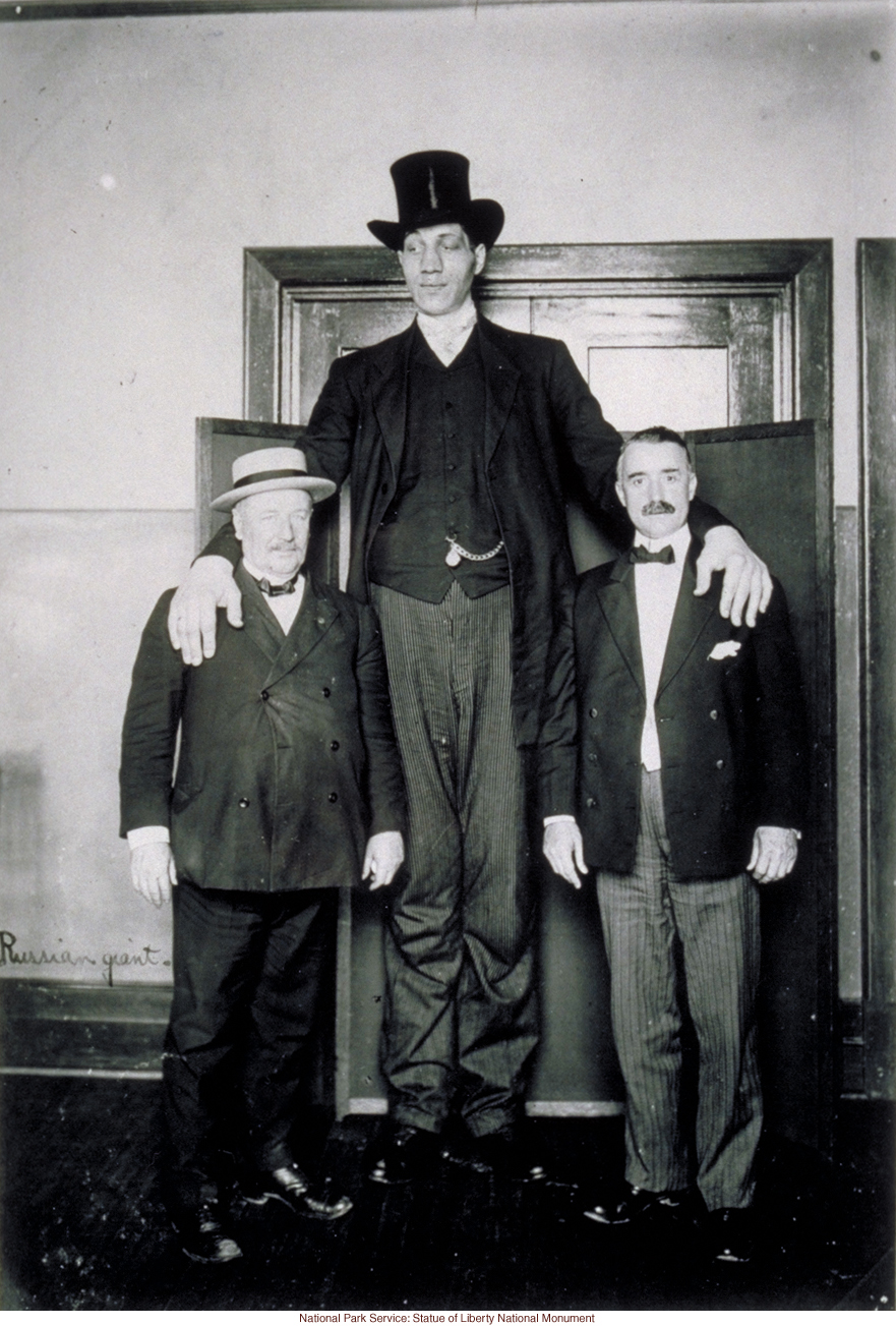 Russian giant at Ellis Island (Photograph by Augustus Sherman)